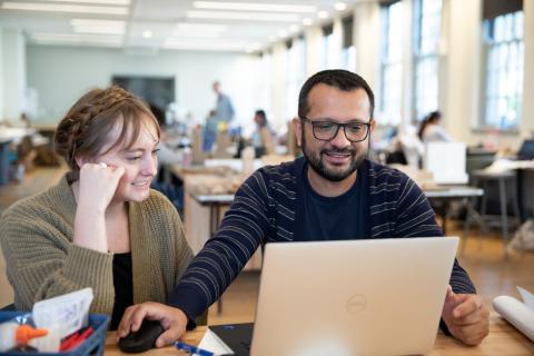 Two students with computer