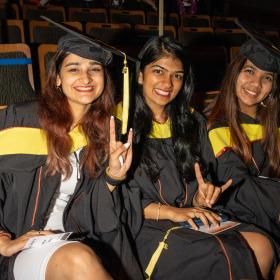 Three students at convocation