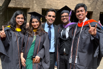 Students in regalia outside