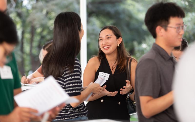 students talk outside
